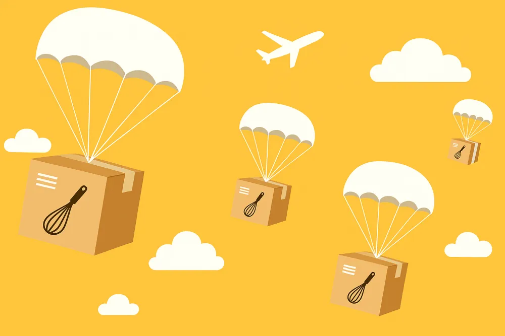 kartonnen dozen met parachute vallen uit lucht
